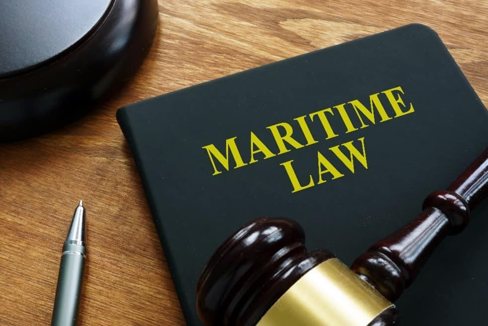 Maritime Law book with a pen and gavel