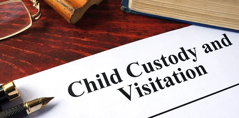 A paper with a text that says child custody and visitation